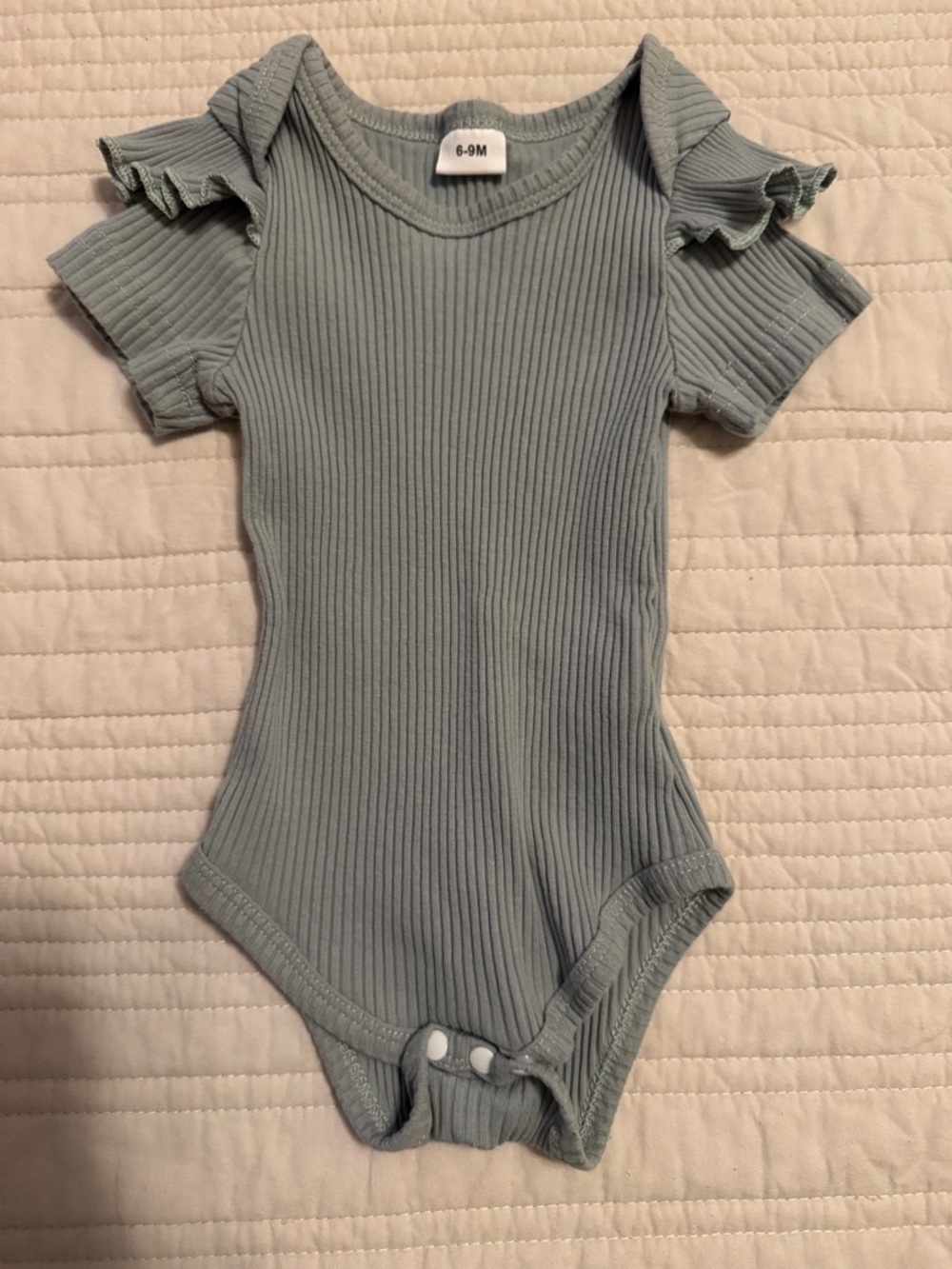 Ribbed Ruffle Shoulder One-Piece Bodysuit